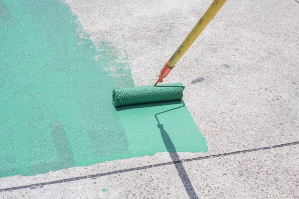 Hand,Painting,A,Green,Floor,With,A,Paint,Roller,For